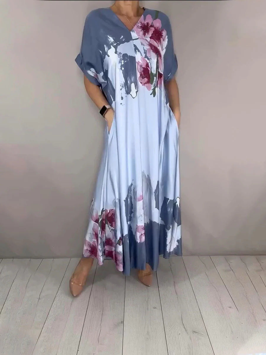 Damen Maxikleid mit weitem Fall, V-Ausschnitt, Eingrifftaschen und floraler Aquarelloptik Drune