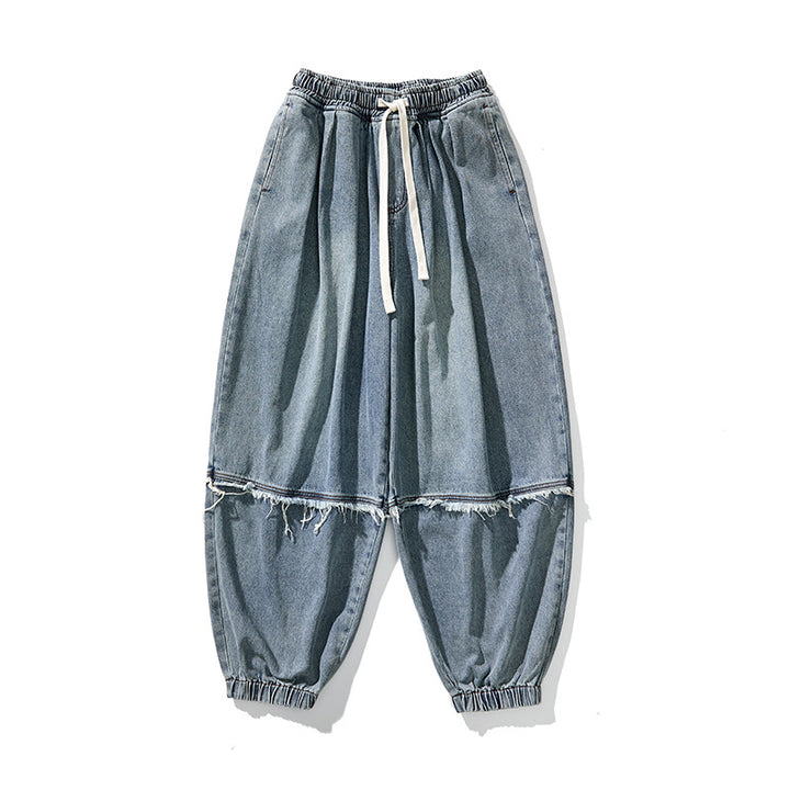 Herren Weit geschnittene Baggy-Denim-Hose mit Tunnelzug, elastischen Beinabschlüssen und Fransen-Detail Drune