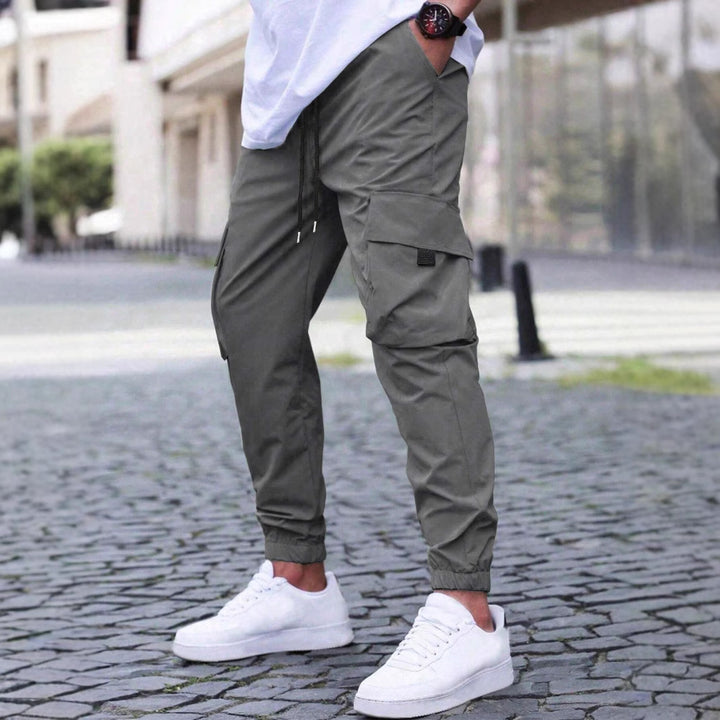 Herren technische Travel-Joggerhose mit integriertem Sicherheitsfach elastischem Tunnelzugbund und wasserabweisender Beschichtung Drune