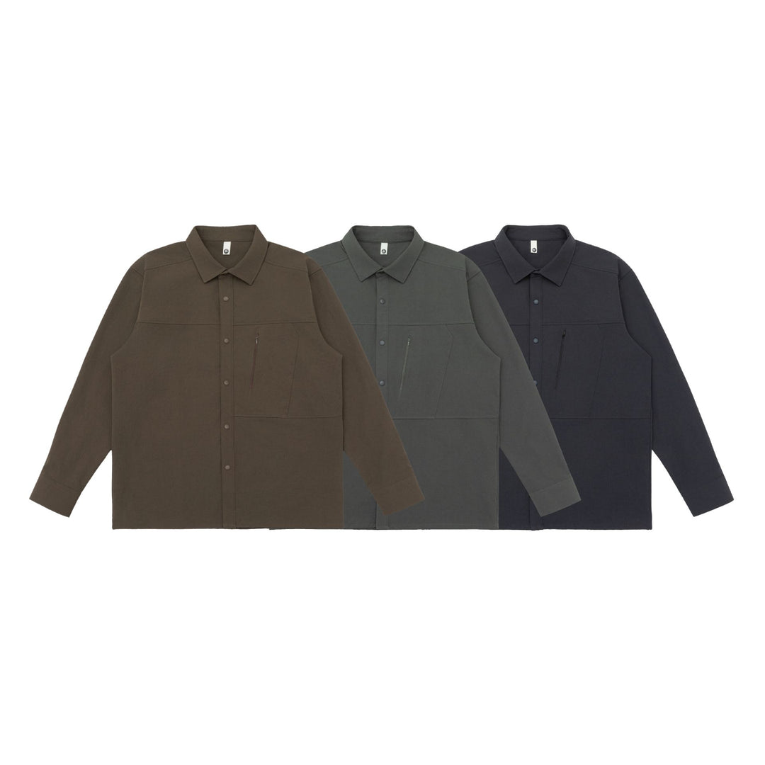 Unisex Oversize-Hemdjacke im Utility‑Style mit verdeckter Druckknopfleiste und diagonaler Reißverschlusstasche Drune