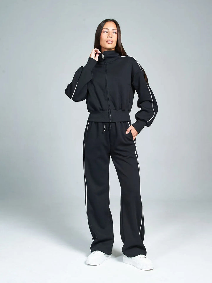 Damen Sportanzug mit hohem Stehkragen und weiten Hosen Drune