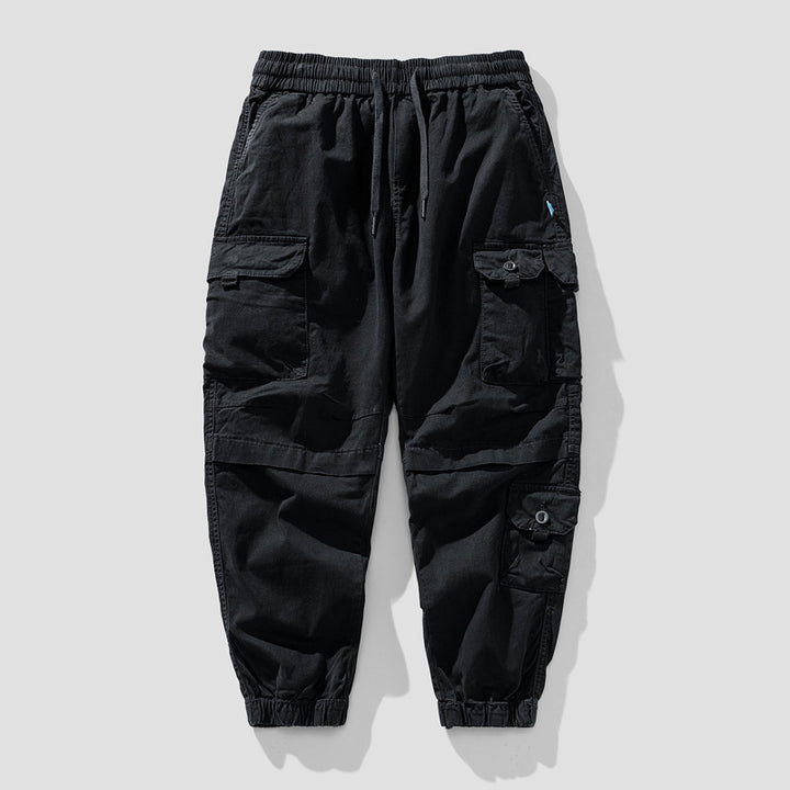Herren Leichte Canvas-Cargohose im Joggerstil mit elastischem Bund, segmentierten Kniepaneelen und verdeckten Klappentaschen Drune