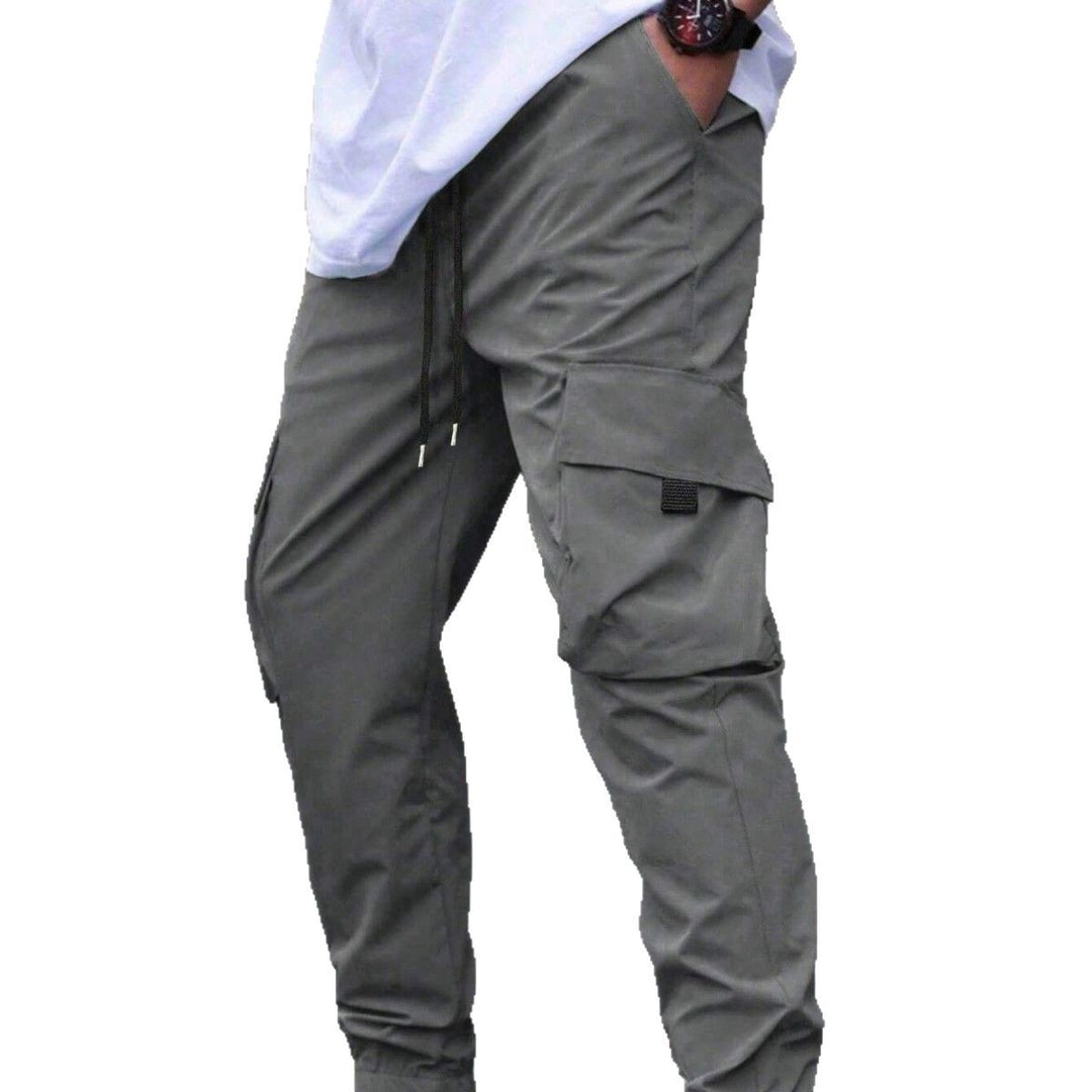Herren technische Travel-Joggerhose mit integriertem Sicherheitsfach elastischem Tunnelzugbund und wasserabweisender Beschichtung Drune