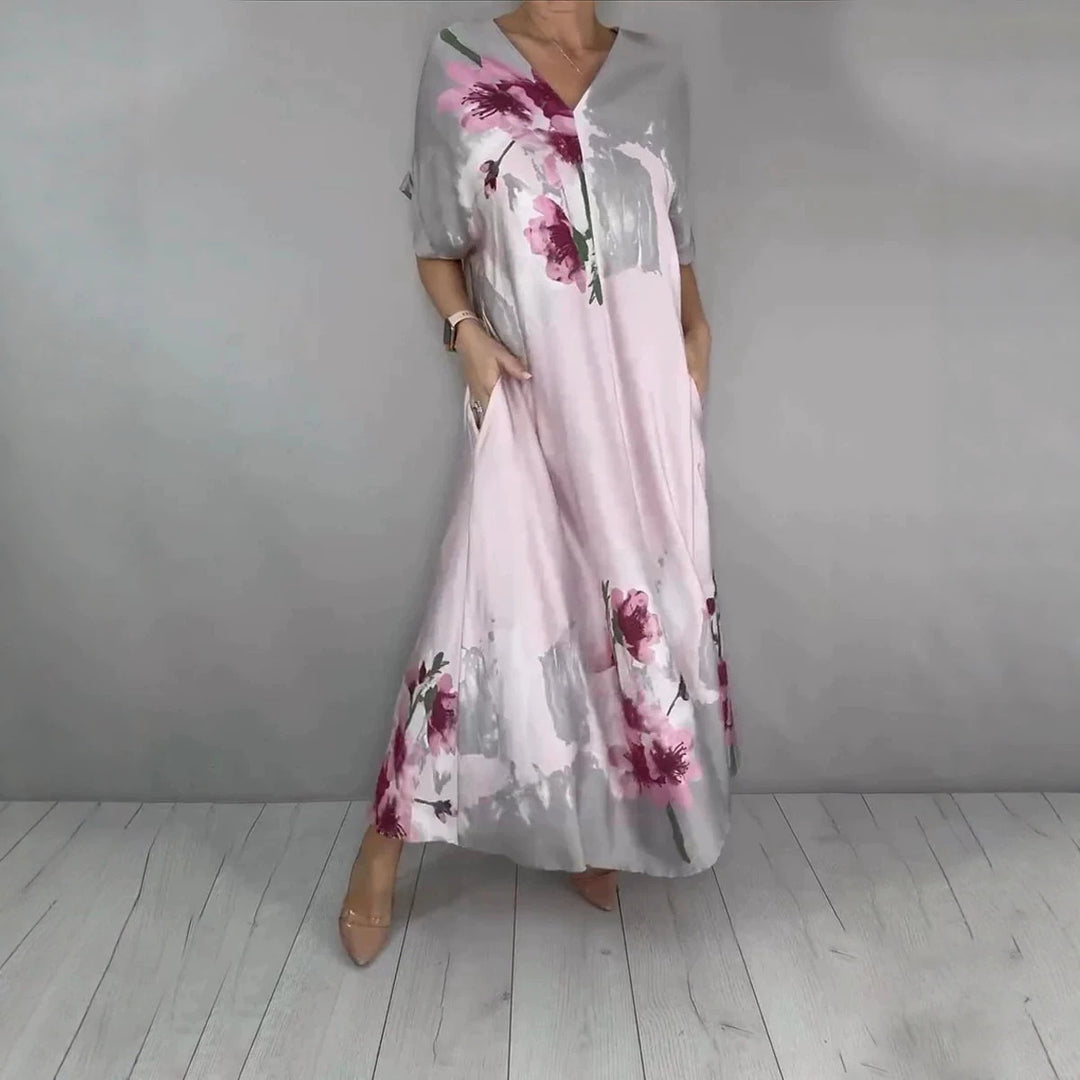 Damen Maxikleid mit weitem Fall, V-Ausschnitt, Eingrifftaschen und floraler Aquarelloptik Drune