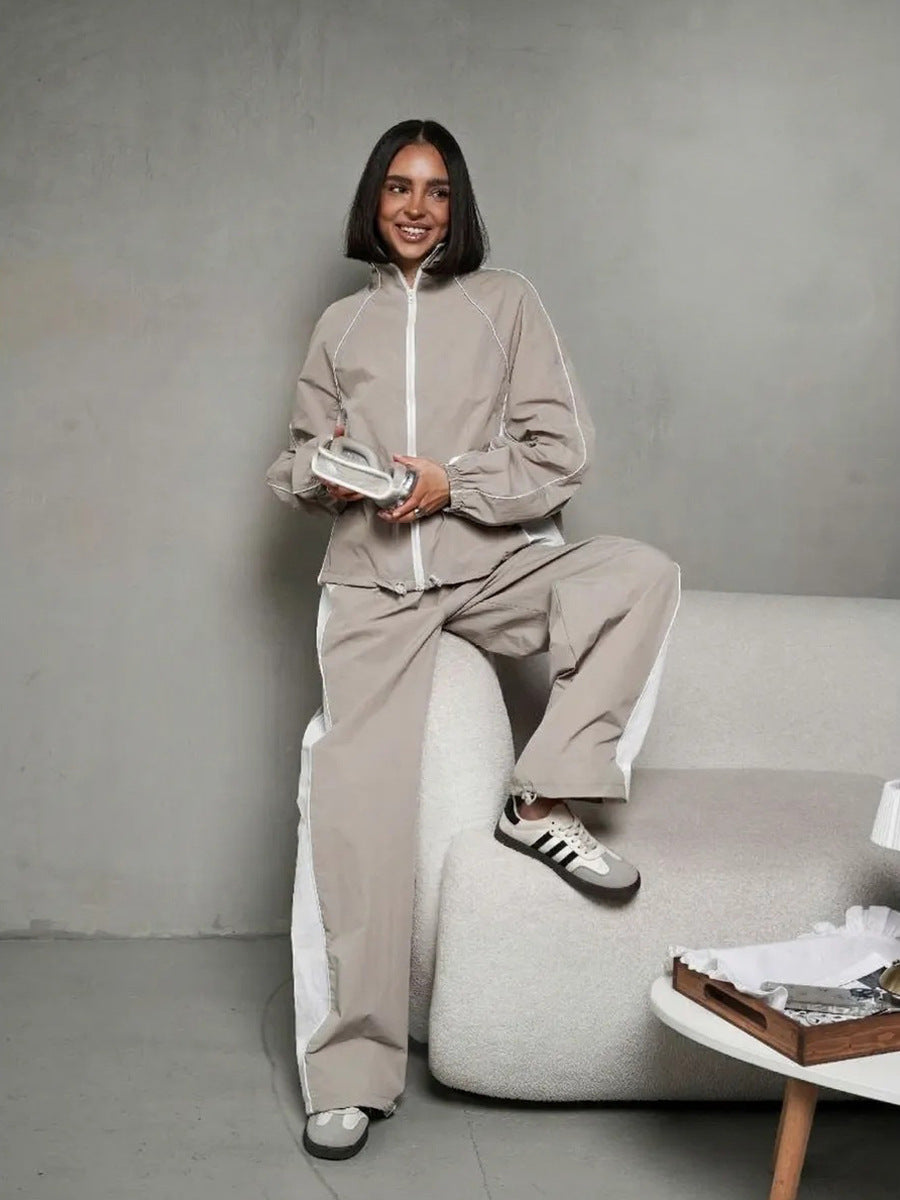 Damen sportlich-elegantes Trackset mit Stehkragen, Reißverschlussjacke und weitem Seitenstreifen-Hose Drune