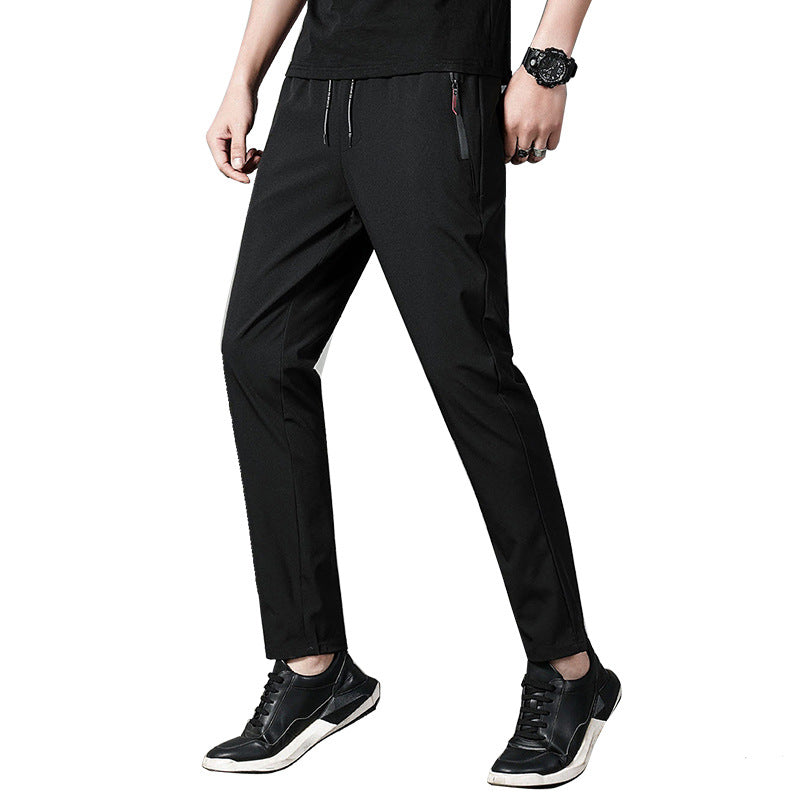 Herren schmal geschnittene Tech-Chino Jogginghose mit elastischem Kordelbund, verdeckten Reißverschlusstaschen und vorgeformten Knien Drune