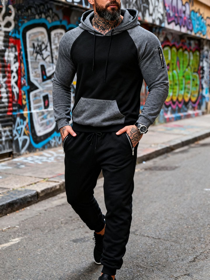 Herren nan zweiteiliges Kapuzen-Sweatset mit Raglanärmeln, Ärmel-Zip-Tasche und tapered Jogginghose Drune