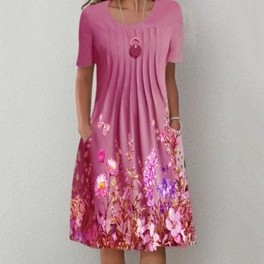 Damen Plissee Midi Kleid mit kurzen Ärmeln, seitlichen Taschen und floralem Saum Drune