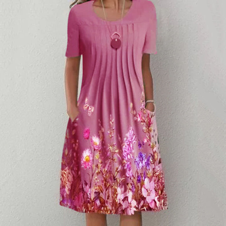 Damen Plissee Midi Kleid mit kurzen Ärmeln, seitlichen Taschen und floralem Saum Drune