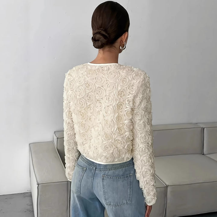 Damen kurz geschnittene Blütenjacke mit floralem Design und sanften Texturen Drune
