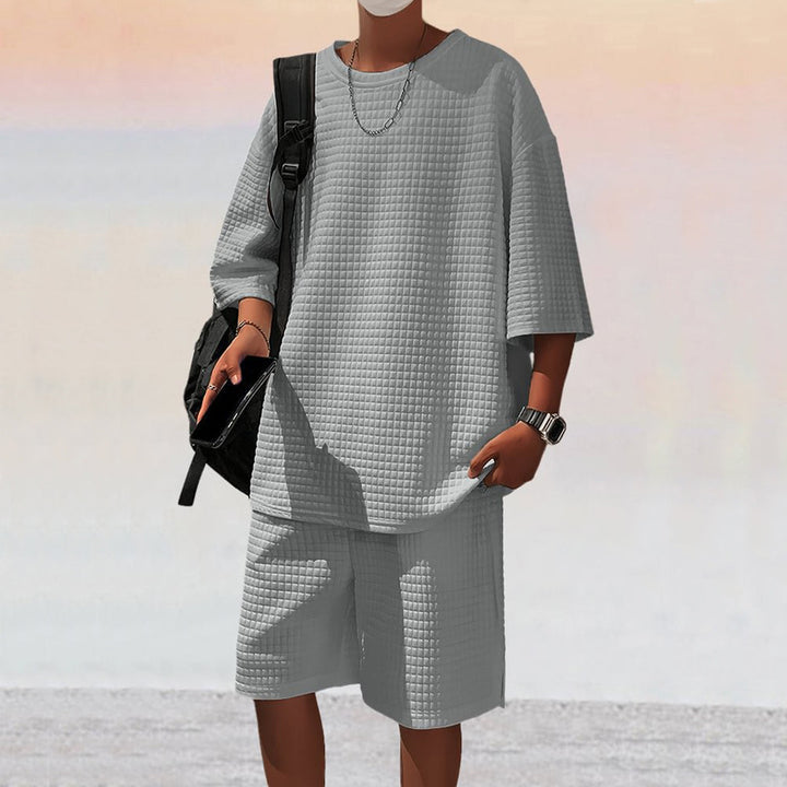 Herren nan quadratstruktur Freizeitset mit oversized Rundhalsshirt und knielangen Relax-Shorts Drune