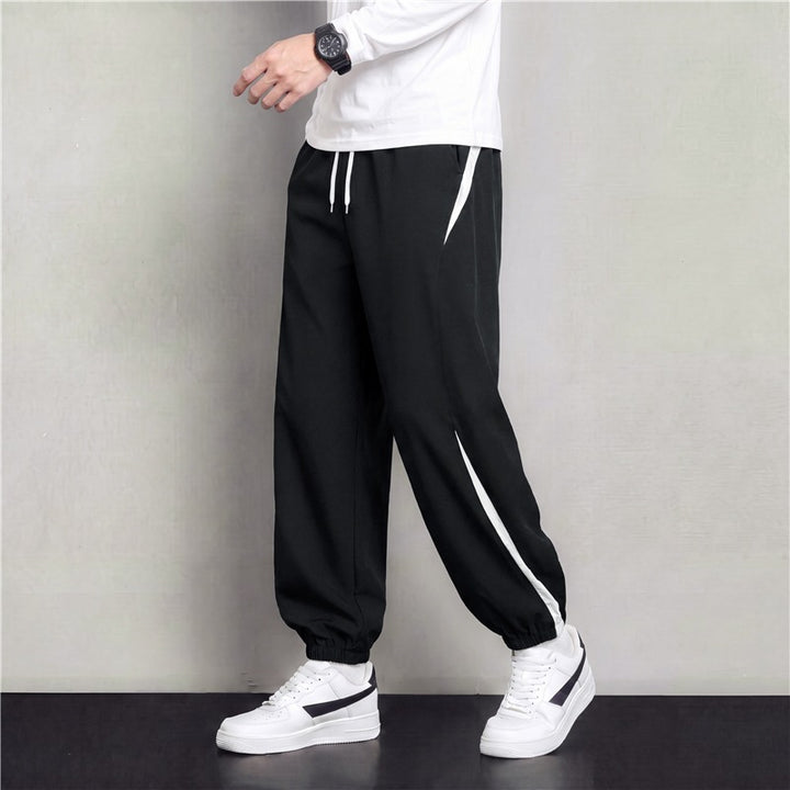Herren Athleisure Jogginghose im Baggy‑Schnitt mit elastischem Bund, Tunnelzug und seitlichen Kontrastkeilen Drune