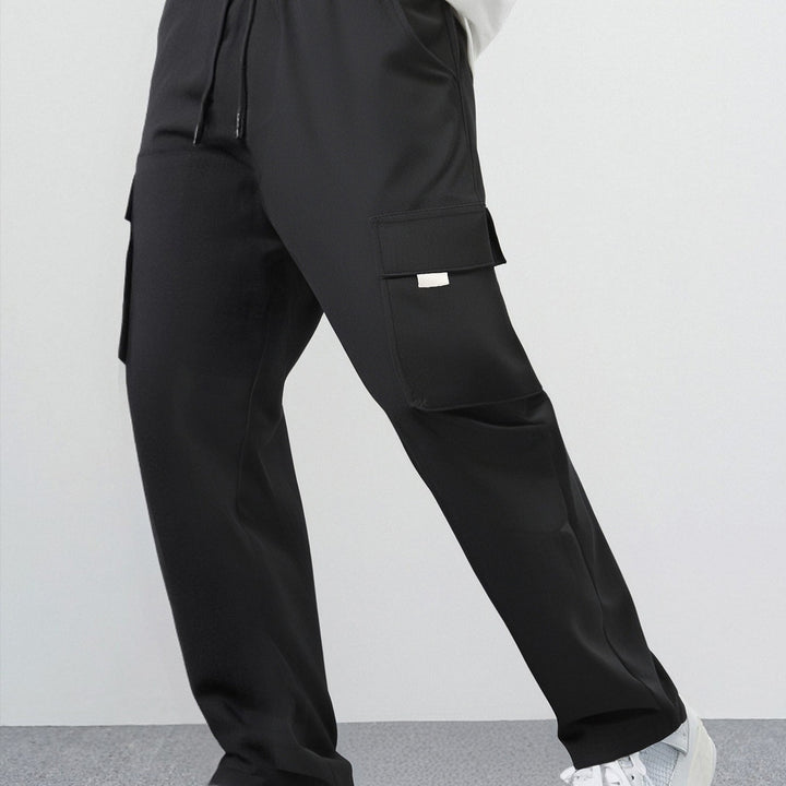 Herren Weite Cargo-Freizeithose aus leichtem Funktionsstoff mit großen Pattentaschen Drune