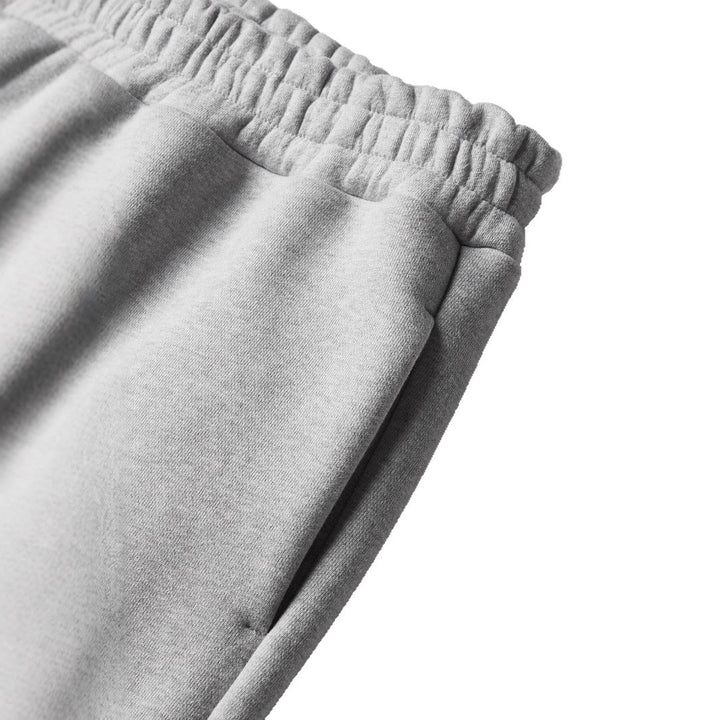 Unisex nan gerade geschnittene Jogginghose mit hohem Elastikbund und seitlichen Eingrifftaschen Drune