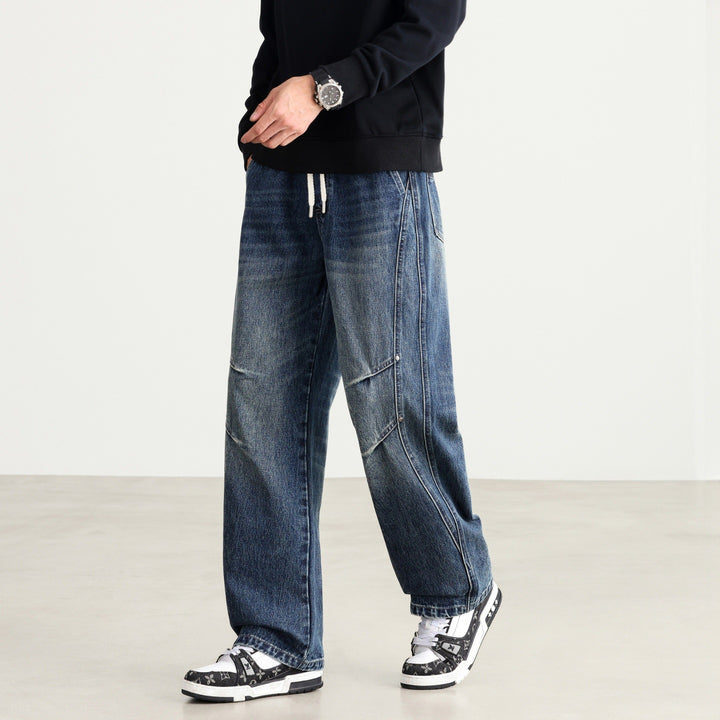 Herren Weite Denim-Hose mit Tunnelzugbund, Paneelnähten und Used-Waschung Drune