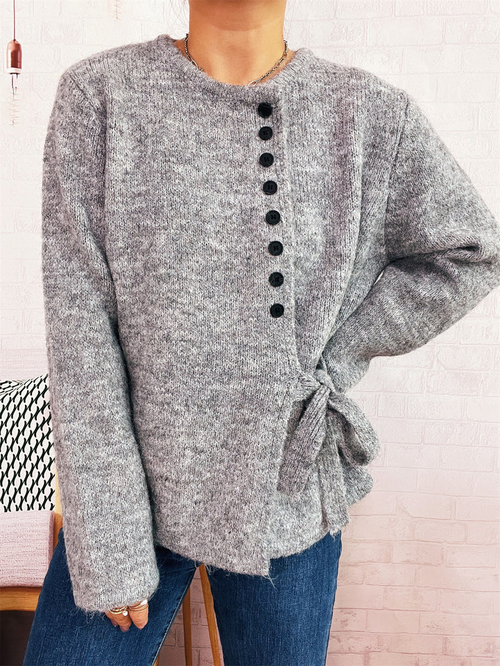 Damen verspielter Strickpullover mit seitlichem Knoten und Knopfdetail Drune