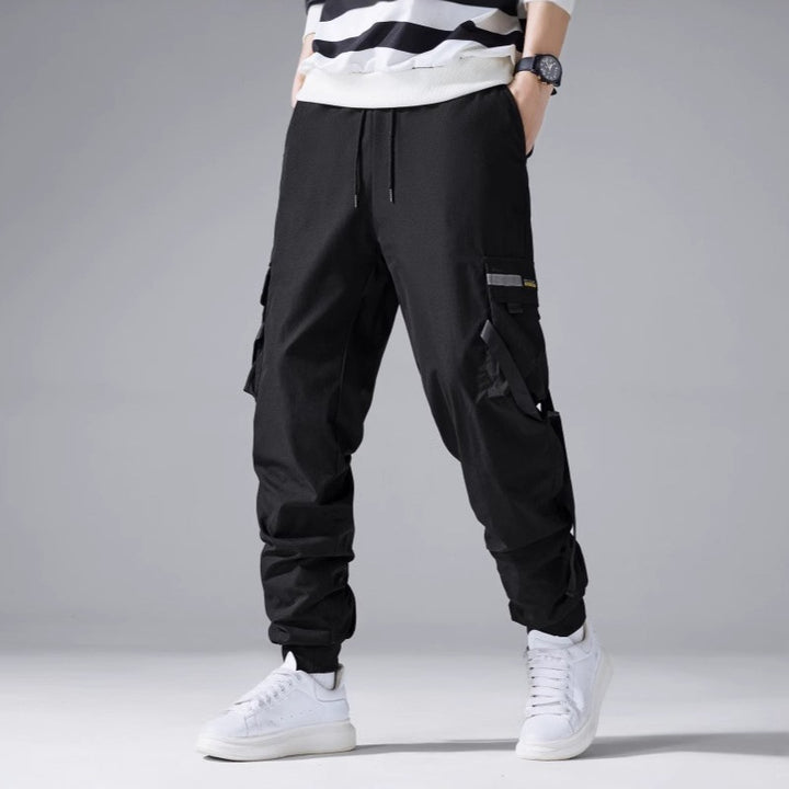 Herren Tech‑Cargo‑Jogger mit taktischen Klappentaschen, verstellbaren Nylonriemen und elastischem Knöchelsaum Drune