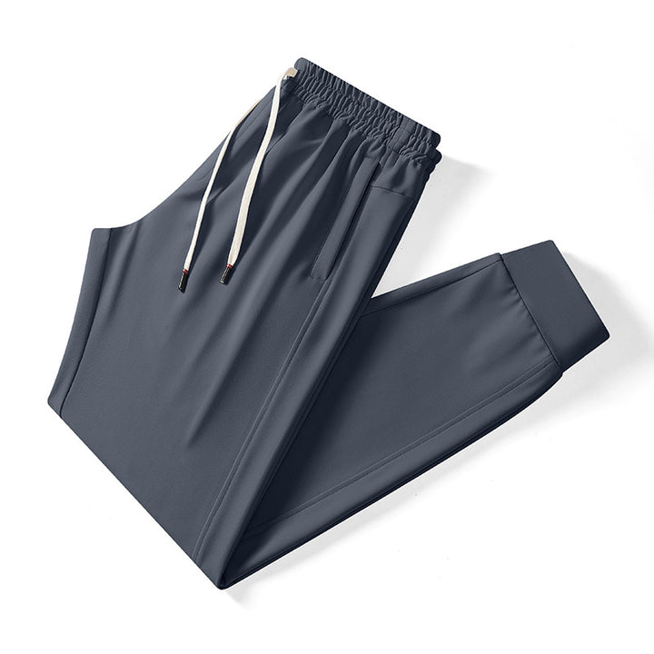 Herren athletische Tech-Jogginghose mit elastischem Kordelbund, verdeckten Reißverschlusstaschen und formgebenden Knöchelbündchen Drune