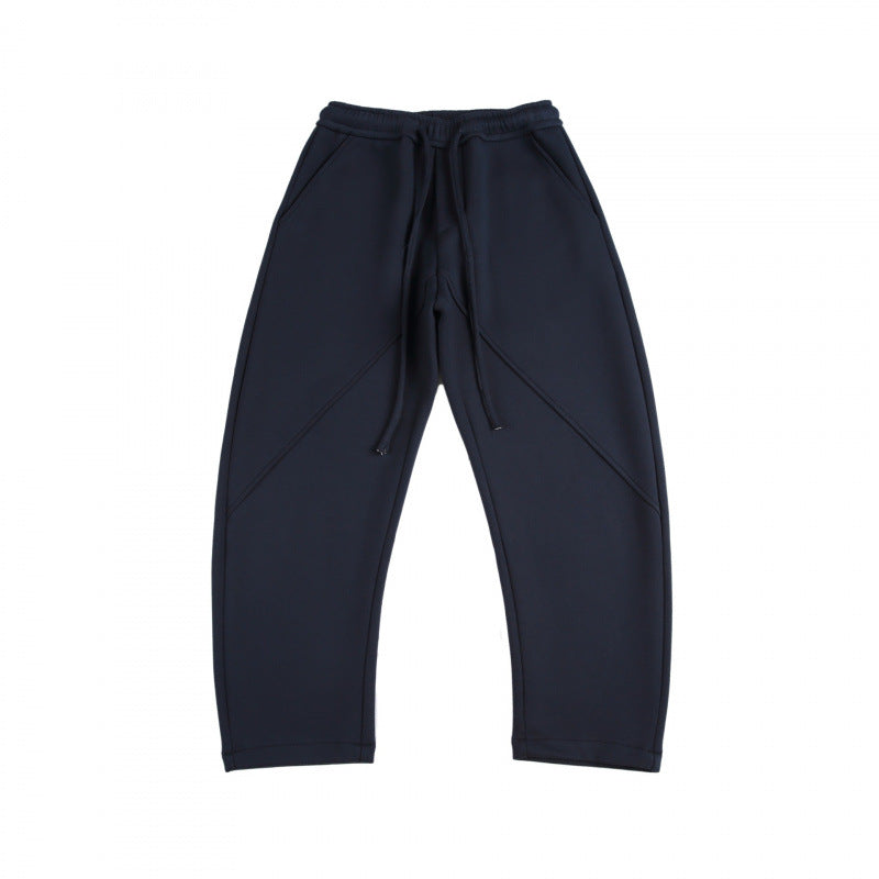Unisex Weite Tech-Jogginghose mit diagonalem Nahtdesign, Elastikbund und Tunnelzug Drune