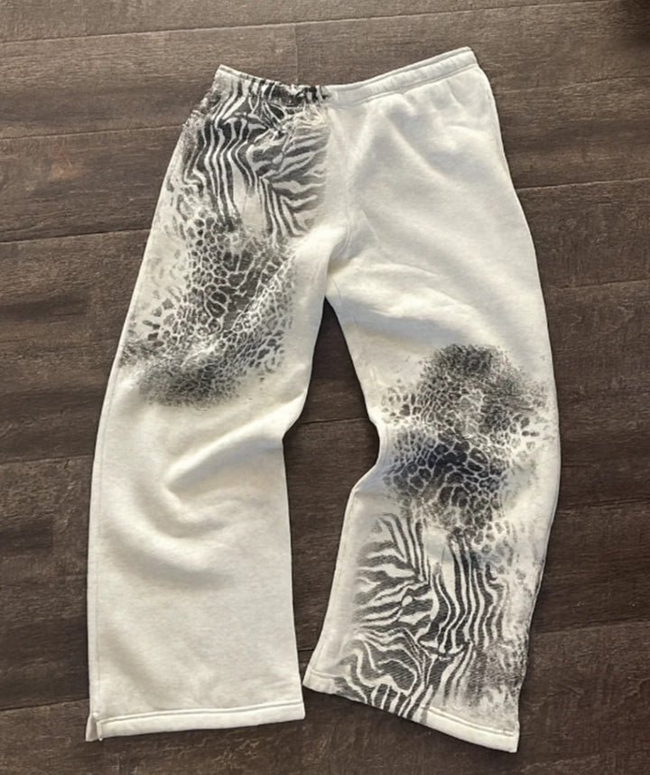 Damen nan lockere Sweathose mit asymmetrischem Animal-Print, elastischem Komfortbund und geradem Bein Drune