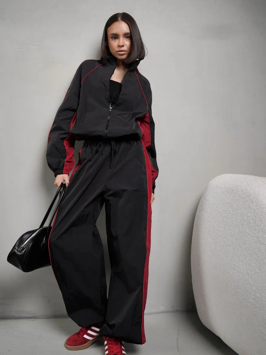 Damen sportlich-elegantes Trackset mit Stehkragen, Reißverschlussjacke und weitem Seitenstreifen-Hose Drune