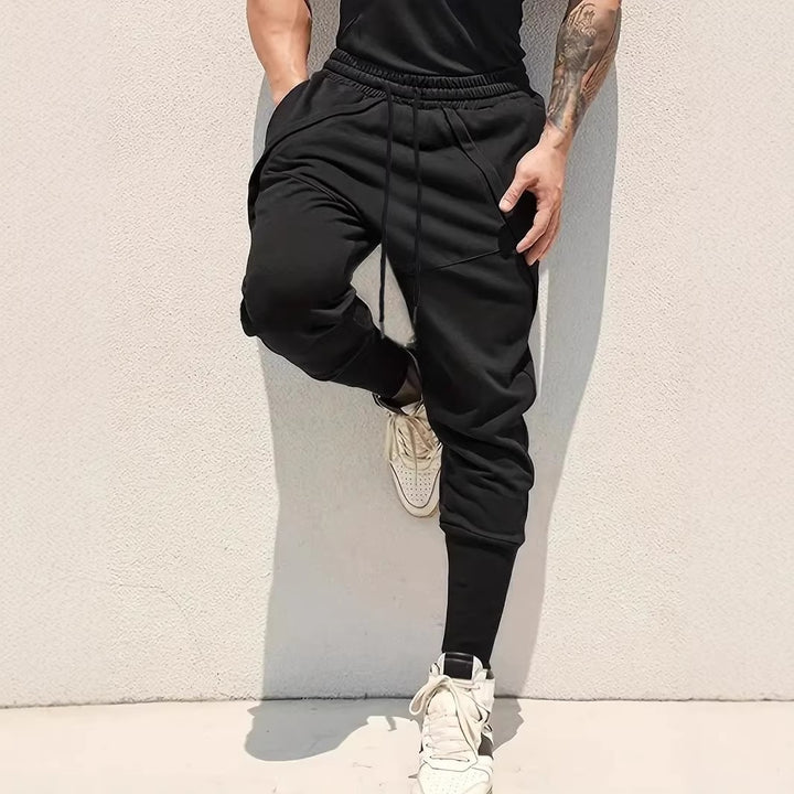 Herren Tapered-Jogginghose mit tiefem Schritt, elastischem Bund & diagonalgesetzten Taschen Drune