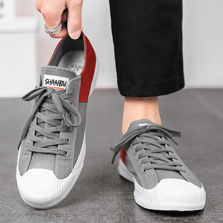 Unisex niedrige Canvas-Sneaker mit verstärkter Gummi-Zehenkappe und kontrastierenden Textilpaneelen Drune
