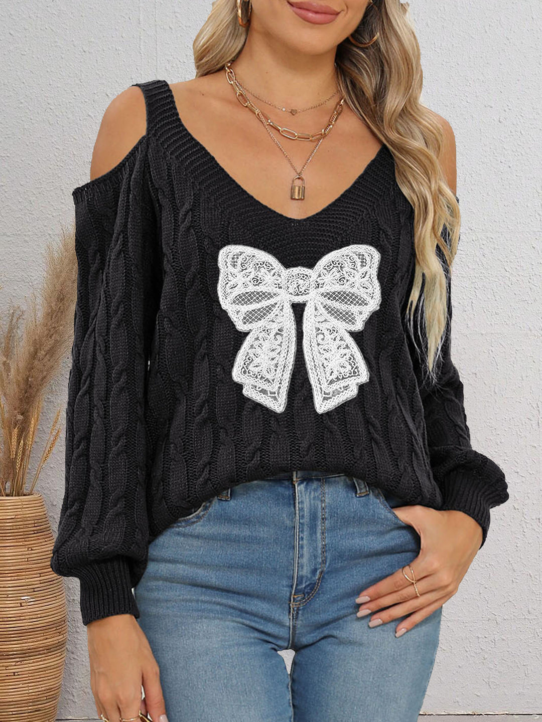 Damen modischer Pullover mit verspielt eingestricktem Schleifenmotiv Drune