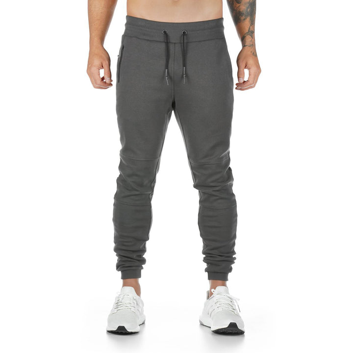 Herren nan schmal geschnittene Jogginghose mit Rippbund, Reißverschlusstasche und Knieabnähern Drune