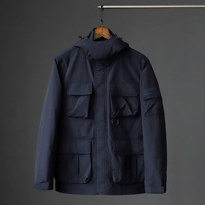 Herren urbane Feldjacke mit Mehrfach‑Taschen, windabweisender Oberfläche und verdeckter Kapuze Drune