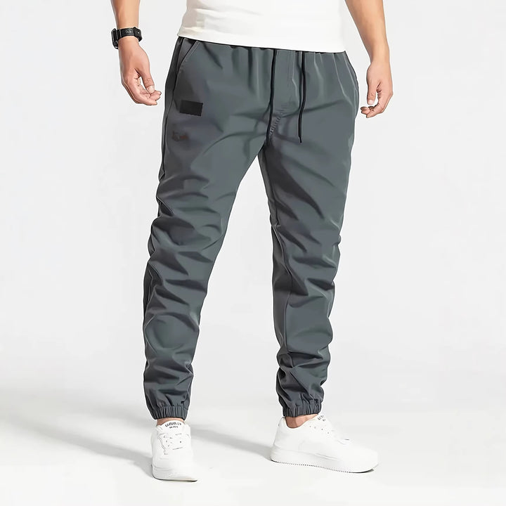 Herren Technische Jogginghose im Tapered‑Utility‑Stil mit elastischem Bund & Knöchelbündchen Drune