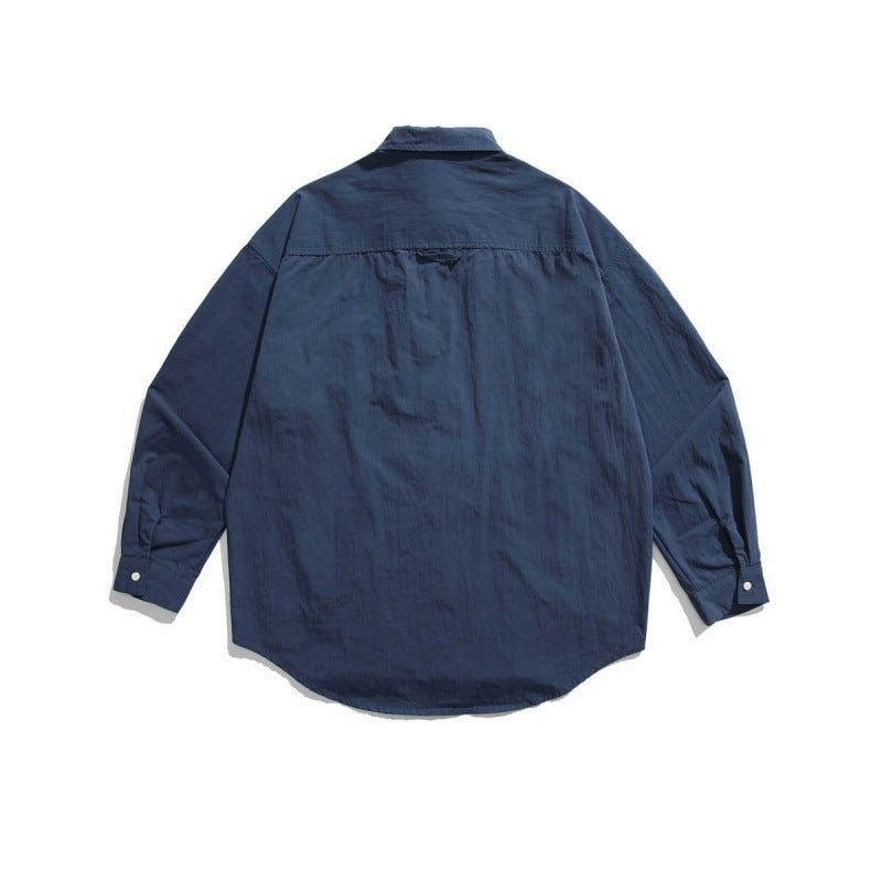 Unisex Boxy-Überhemdjacke mit Utility-Taschen, abgerundetem Saum und Oversize-Passform Drune