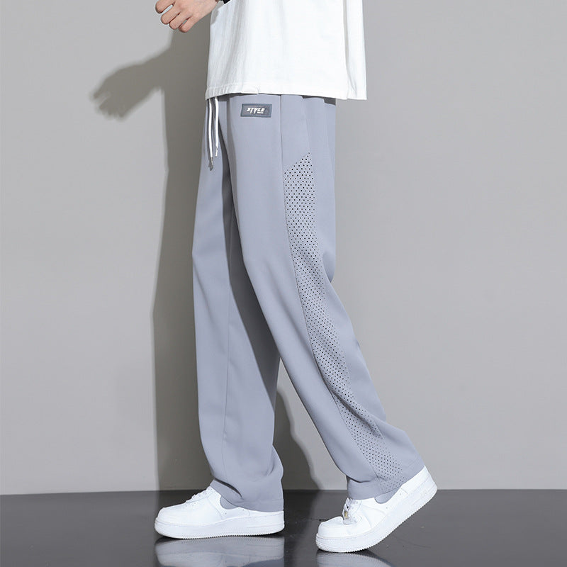 Herren Sportliche Relaxed Fit Jogginghose mit Mesh-Einsätzen