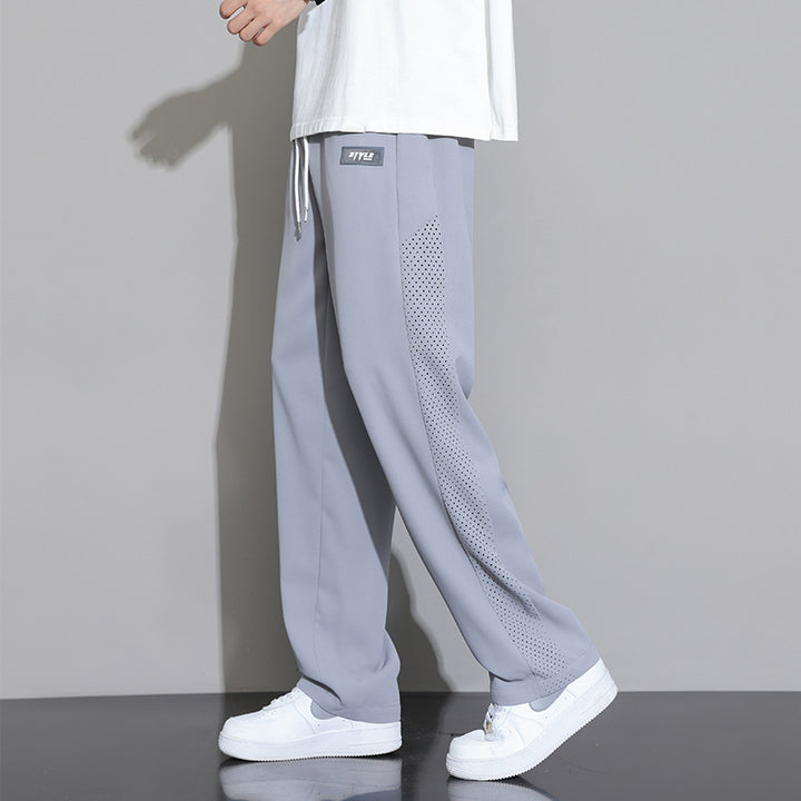 Herren Sportliche Relaxed Fit Jogginghose mit Mesh-Einsätzen