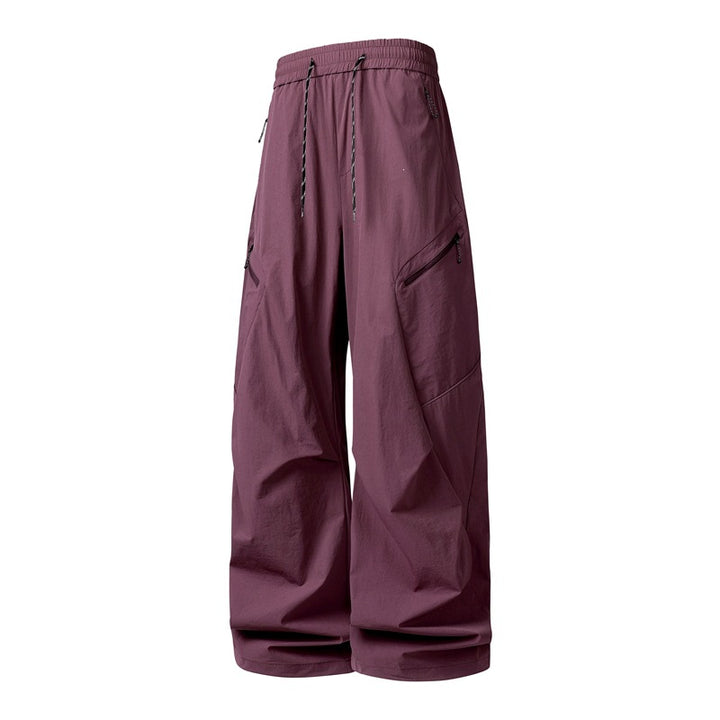 Herren Oversize-Utility-Cargo-Hose aus leichtem Nylon mit elastischem Kordbund, seitlichen Reißverschlusstaschen & weiter Ballon-Silhouette Drune