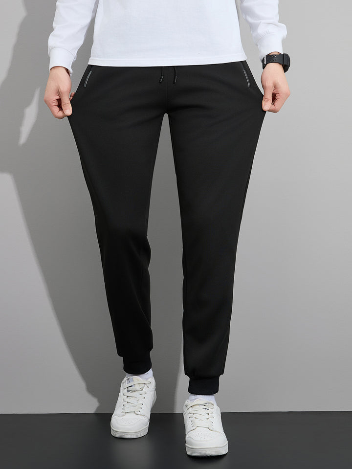 Herren Tapered Performance-Jogginghose mit elastischem Bund, Reißverschlusstaschen & gerippten Beinbündchen Drune