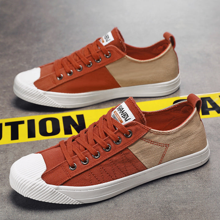 Unisex niedrige Canvas-Sneaker mit verstärkter Gummi-Zehenkappe und kontrastierenden Textilpaneelen Drune