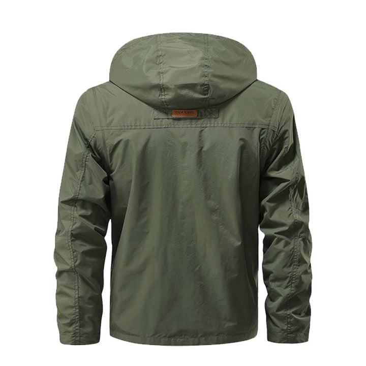 Herren nan multifunktionale Fieldjacke mit Kapuze, zahlreichen Klapp- und Reißverschlusstaschen sowie wind- und wasserabweisender Membran Drune