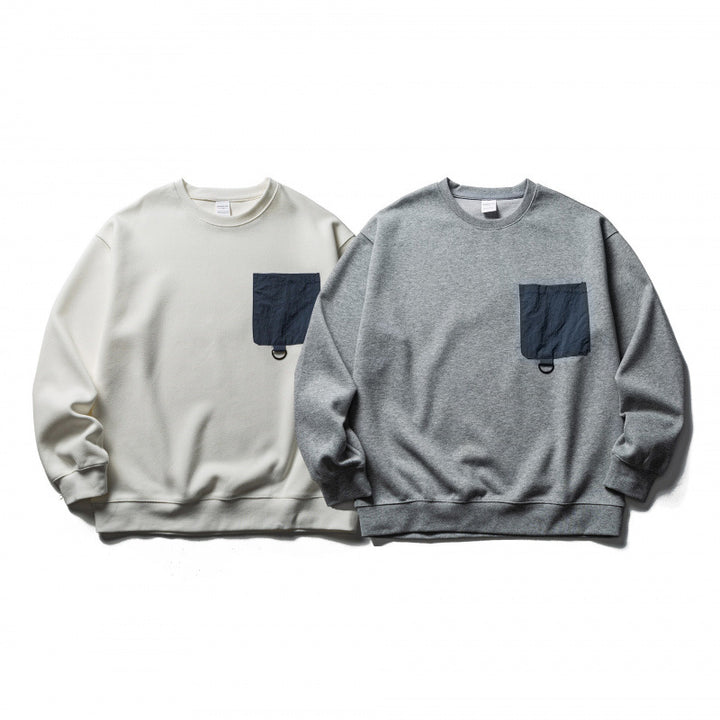 Unisex Oversize-Sweatshirt mit aufgesetzter Brusttasche und D-Ring Drune