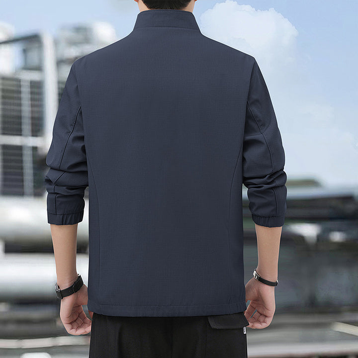 Herren Leichte Alltags-Softshelljacke mit Stehkragen, windabweisender Membran und Reißverschlusstaschen Drune