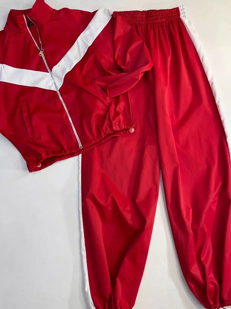 Damen tailliertes Zip-Trainingsset mit Chevron-Einsatz, Kordelzugsaum und hochgeschnittener Jogginghose Drune