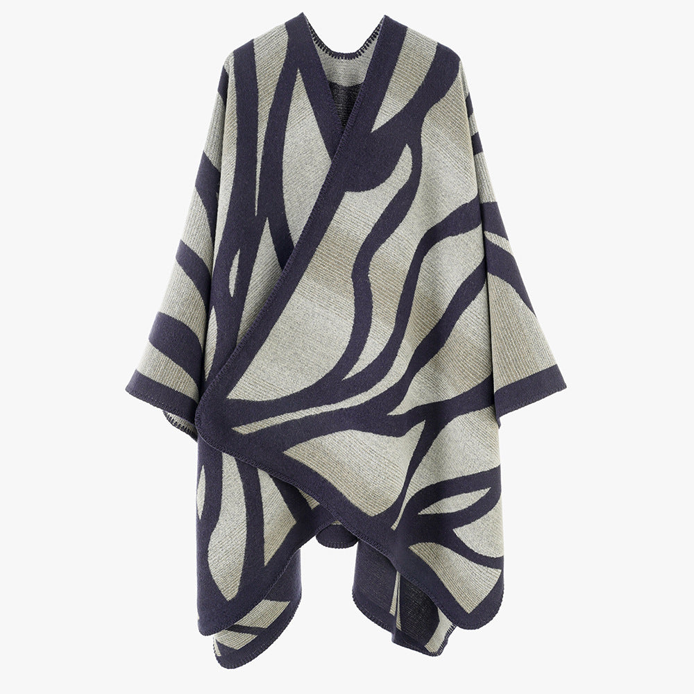Damen Oversize-Strickcape mit abstrakter Wellenjacquard‑Struktur und kontrastierter Kettelkante Drune