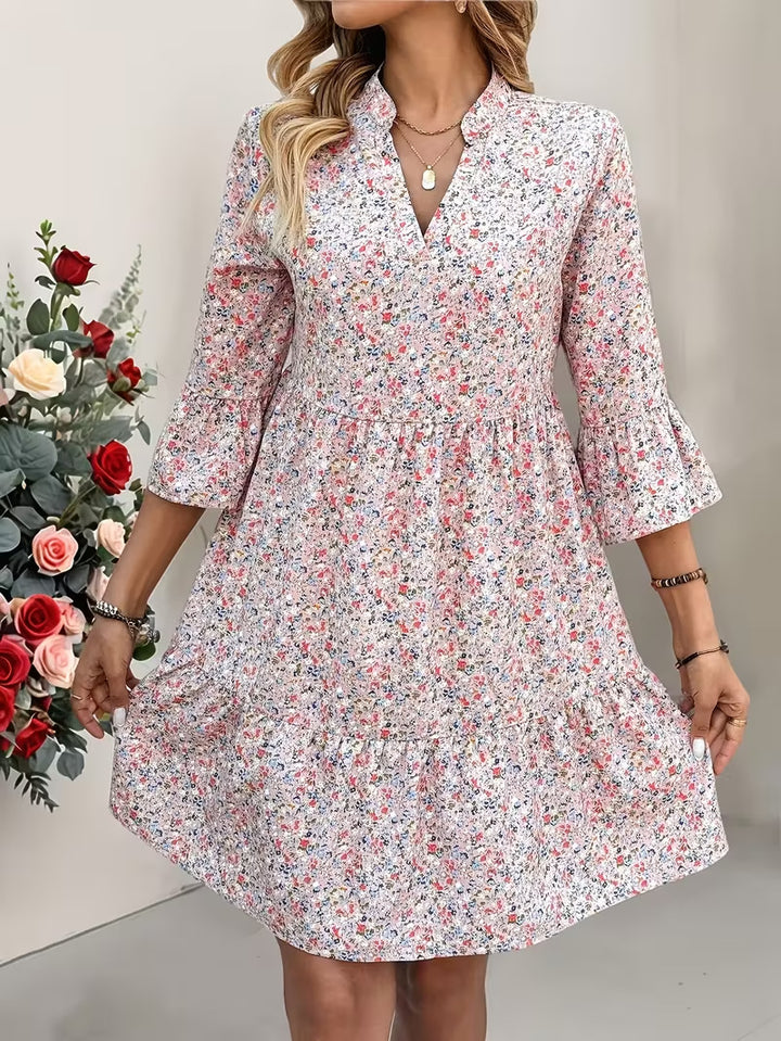 Damen Florales Babydoll-Kleid mit V-Ausschnitt, hohem Empire‑Bund und Glockenärmeln Drune