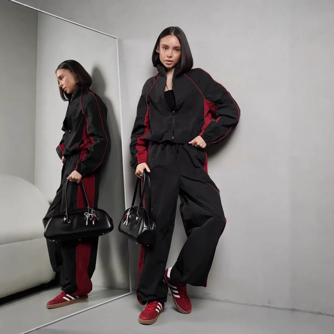 Damen sportlich-elegantes Trackset mit Stehkragen, Reißverschlussjacke und weitem Seitenstreifen-Hose Drune