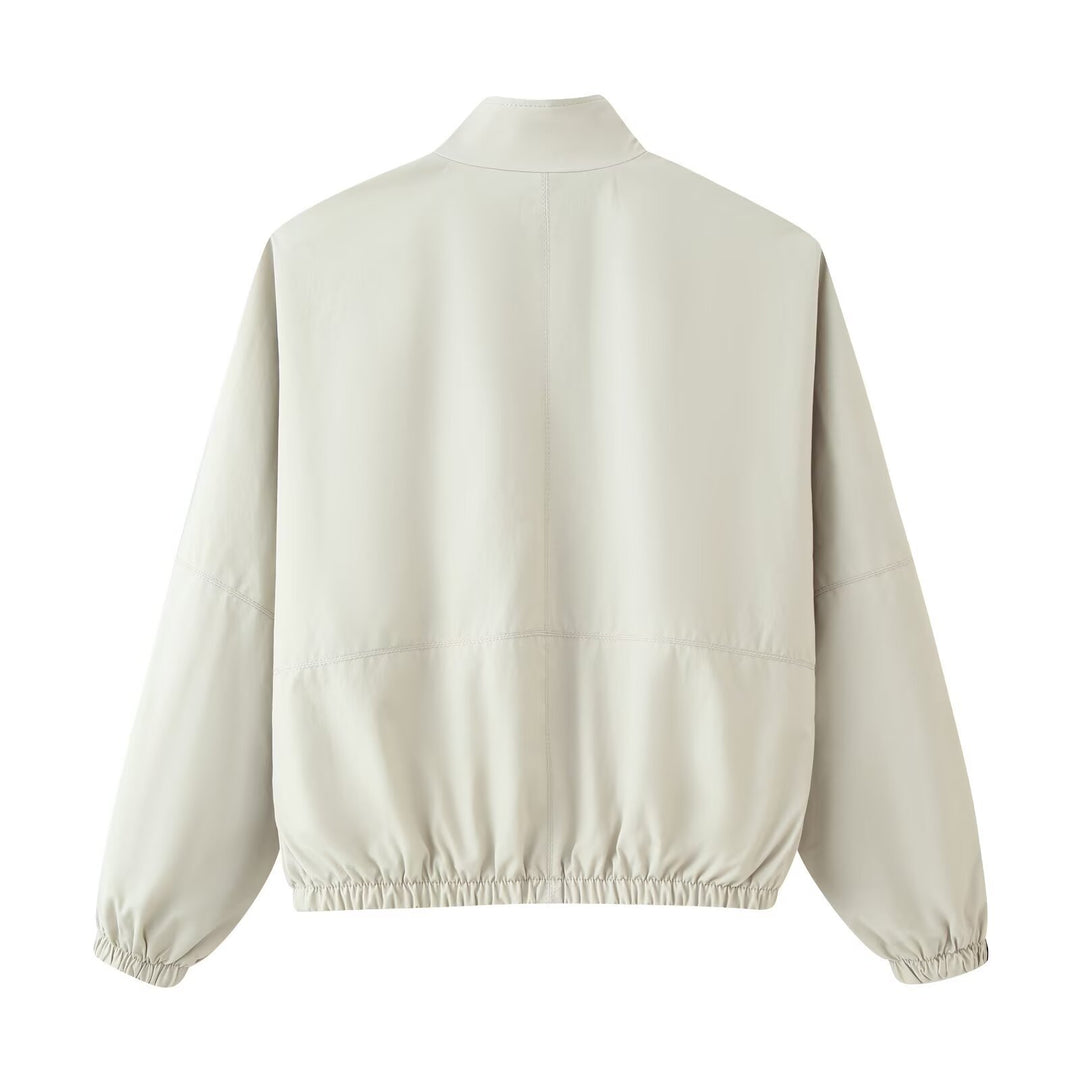Damen Cropped Windjacke aus technischem Material mit hohem Stehkragen und Kontrastpaspel Drune