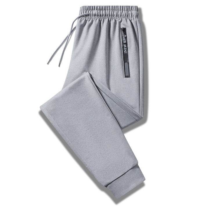 Herren Sportliche Trainingshose mit elastischem Tunnelzugbund, Reißverschlusstasche und glattem Performance‑Material Drune