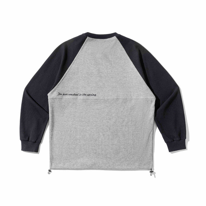 Unisex Raglan‑Sweatshirt mit Thermowaffelstruktur, Kordelzugsaum und dezenter Bruststickerei Drune