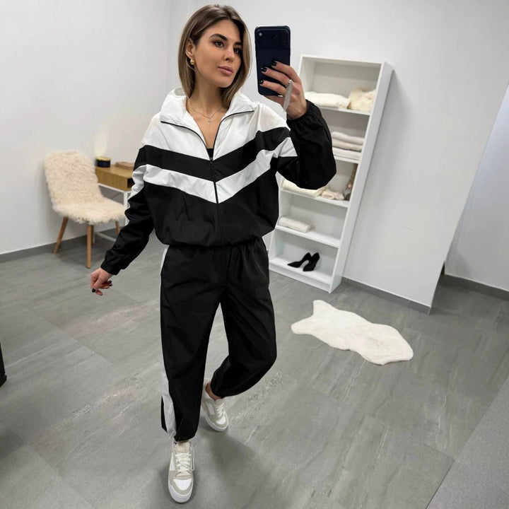 Damen retro Nylon-Trainingsanzug mit Kapuzen-Zipjacke und weiter hochgeschnittener Hose Drune