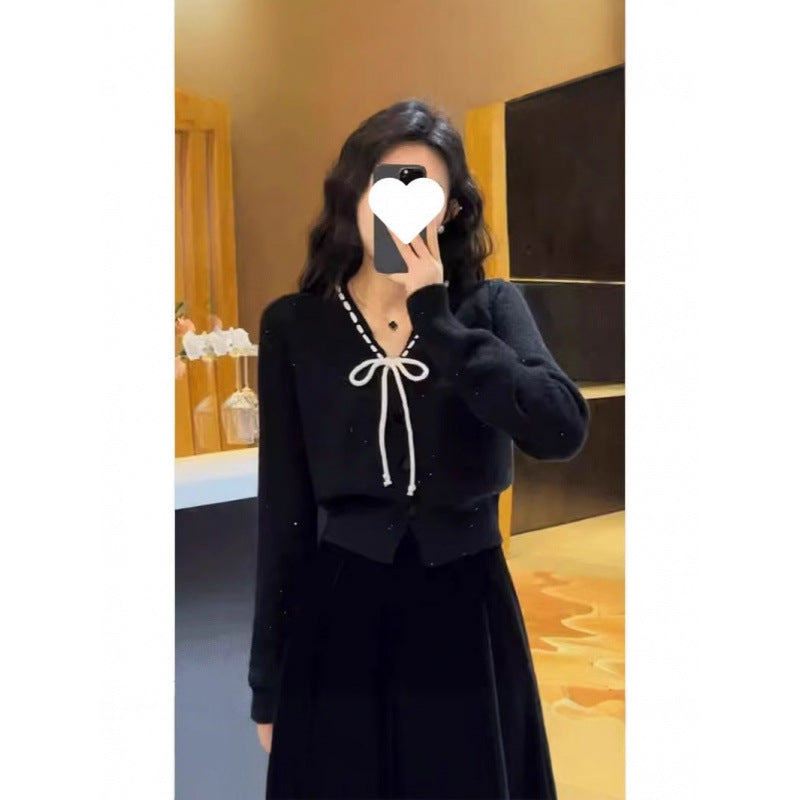 Damen Strickjacke mit dekorativem Schleifenverschluss und Knopfdetails Drune