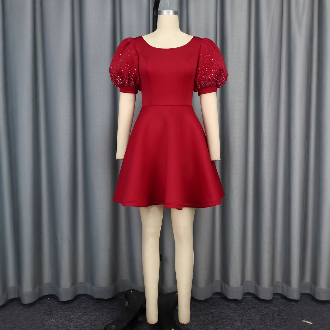 Damen Cocktailkleid mit voluminösen Puffärmeln und schimmernden Akzenten Drune